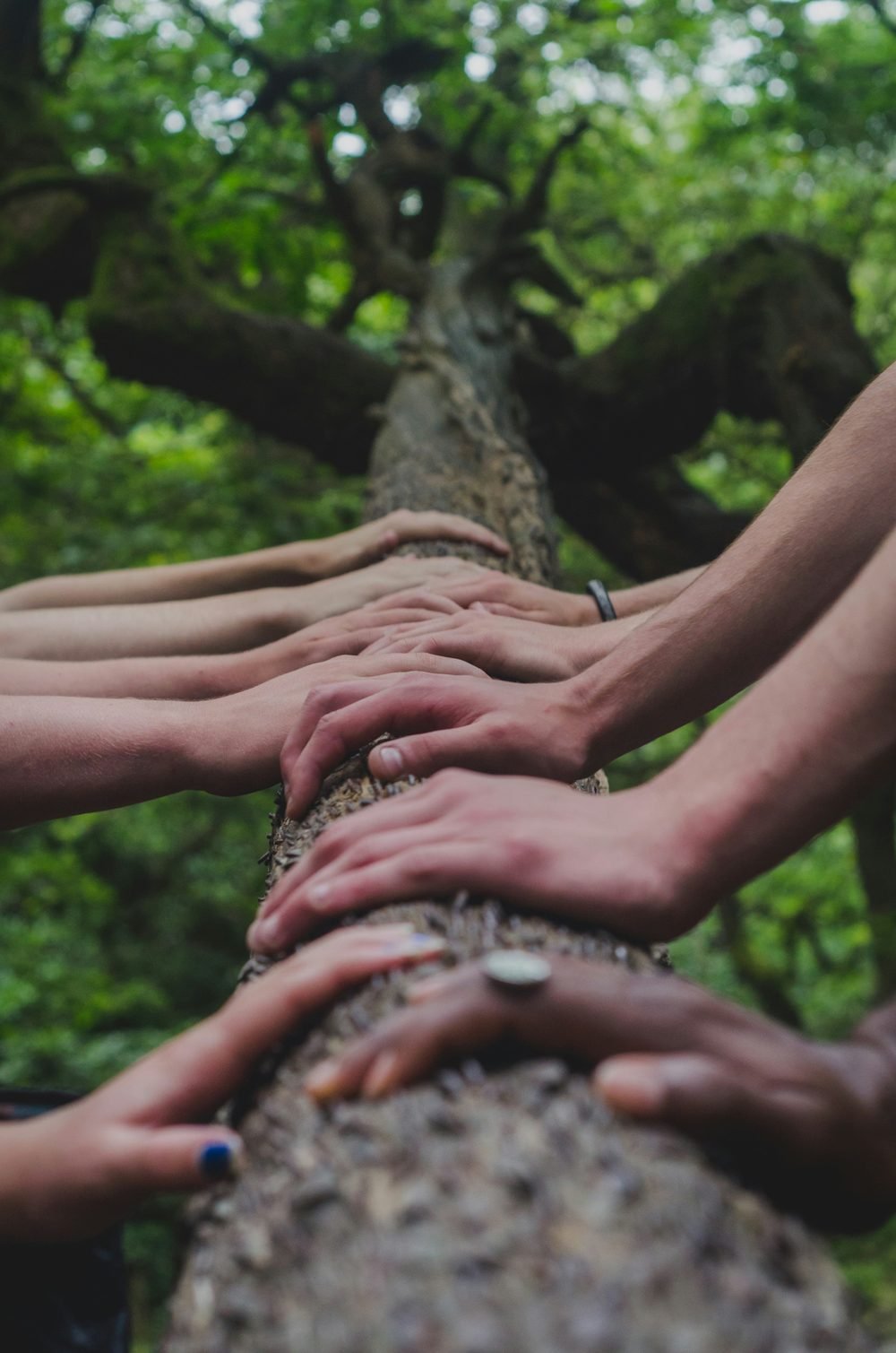 Feet of people standing in a circle — everyone welcome